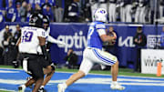 Nov 15, 2025; Provo, Utah, USA; BYU Cougars quarterback Bear Bachmeier (47) runs for a touchdown against the Texas Christian University Horned Frogs during the second quarter at LaVell Edwards Stadium. Mandatory Credit: Rob Gray-Imagn Images