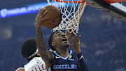 Nov 15, 2025; Cleveland, Ohio, USA; Memphis Grizzlies guard Ja Morant (12) drives to the basket
