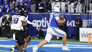 Nov 15, 2025; Provo, Utah, USA; BYU Cougars quarterback Bear Bachmeier (47) runs for a touchdown against the Texas Christian University Horned Frogs during the second quarter at LaVell Edwards Stadium. Mandatory Credit: Rob Gray-Imagn Images