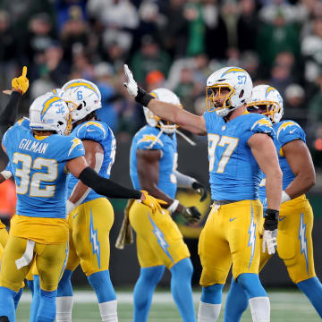 Nov 6, 2023; East Rutherford, New Jersey, USA; Los Angeles Chargers linebacker Joey Bosa (97) celebrates with teammates after recovering a New York Jets fumble during the first quarter at MetLife Stadium. Mandatory Credit: Brad Penner-USA TODAY Sports