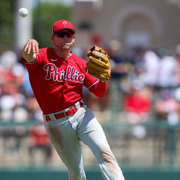 Philadelphia Phillies shortstop Scott Kingery (4) throws to first against the Baltimore Orioles in the fourth inning during spring training at Ed Smith Stadium in 2023.