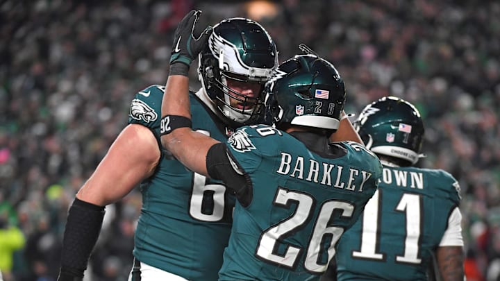 Philadelphia Eagles running back Saquon Barkley (26) celebrates his touchdown with offensive tackle Lane Johnson (65) against the Washington Commanders in the NFC Championship game at Lincoln Financial Field. Philadelphia Eagles running back Saquon Barkley (26) celebrates his touchdown with offensive tackle Lane Johnson (65) against the Washington Commanders in the NFC Championship game at Lincoln Financial Field.