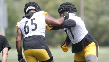 Pittsburgh Steelers offensive tackle Dan Moore Jr. (65) works against offensive tackle Broderick Jones (77)