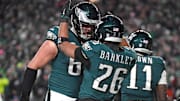 Jan 26, 2025; Philadelphia, PA, USA; Philadelphia Eagles running back Saquon Barkley (26) celebrates his touchdown with offensive tackle Lane Johnson (65) against the Washington Commanders  in the NFC Championship game at Lincoln Financial Field. Mandatory Credit: Eric Hartline-Imagn Images