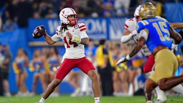 Nov 8, 2025; Pasadena, California, USA; Nebraska Cornhuskers quarterback TJ Lateef (14) throws against the UCLA Bruins during the second half at the Rose Bowl. Mandatory Credit: Gary A. Vasquez-Imagn Images