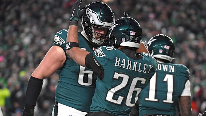 Philadelphia Eagles running back Saquon Barkley celebrates his touchdown with Lane Johnson against the Washington Commanders