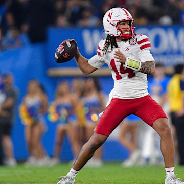 TJ Lateef winds up to pass against the UCLA Bruins during the second half.