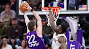 Utah Jazz forward Kyle Filipowski (22) dunks against New Orleans Pelicans forward Zion Williamson (1) during the second half at Delta Center. 