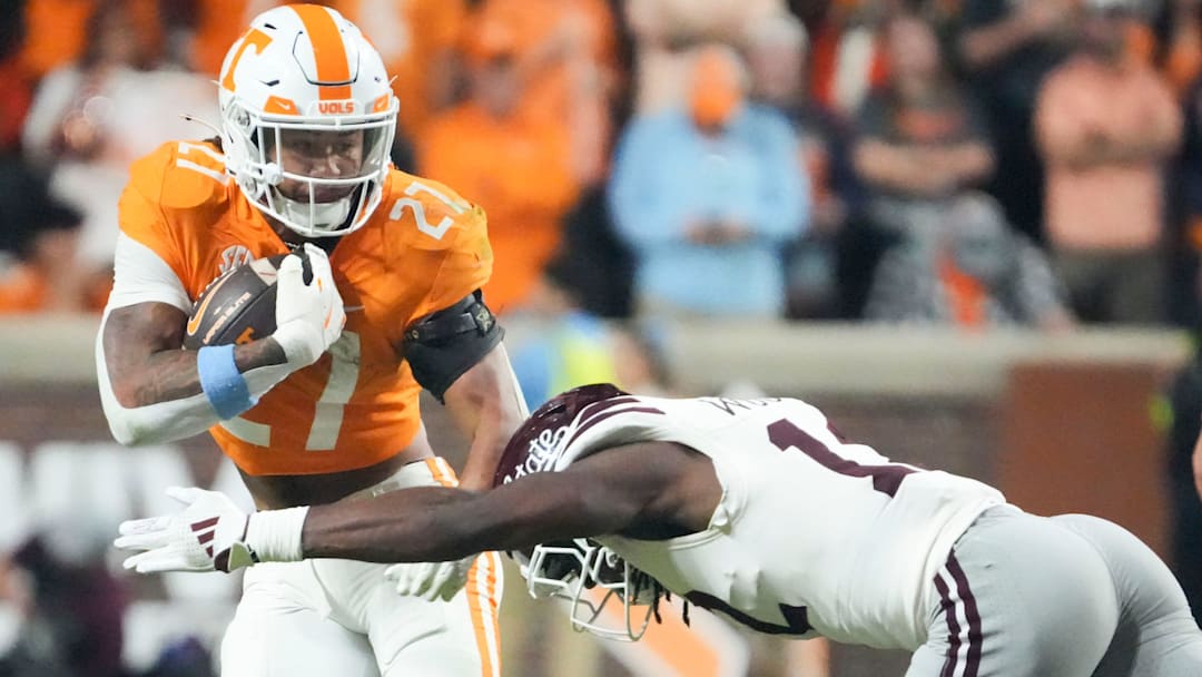 Tennessee running back Peyton Lewis (27) tries to get past Mississippi State safety Tyler Woodard (12) during an NCAA college football game on Saturday, Nov. 9, 2024, in Knoxville, Tenn.