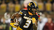 Missouri Tigers wide receiver Luther Burden III (3) runs with the ball during the first half against the Oklahoma Sooners at Faurot Field at Memorial Stadium. 