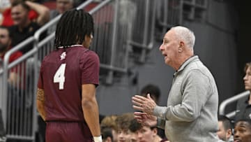 Nov 19, 2024; Louisville, Kentucky, USA;  Bellarmine Knights head coach Scott Davenport talks with guard Dezmond McKinney (4) during the first half against the Louisville Cardinals at KFC Yum! Center. Mandatory Credit: Jamie Rhodes-Imagn Images