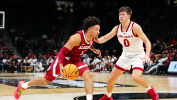Nov 27, 2024; Las Vegas, Nevada, USA; Alabama Crimson Tide guard Mark Sears (1) dribbles against Rutgers Scarlet Knights guard Jordan Derkack (0) during the second half at MGM Grand Garden Arena. Mandatory Credit: Stephen R. Sylvanie-Imagn Images