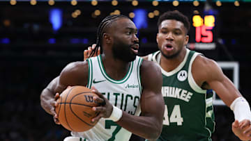 Oct 28, 2024; Boston, Massachusetts, USA; Boston Celtics forward Jaylen Brown (7) drives to the basket defended by Milwaukee Bucks forward Giannis Antetokounmpo (34) during the second half at TD Garden. Mandatory Credit: Paul Rutherford-Imagn Images