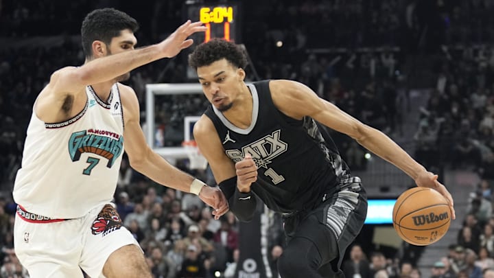Jan 15, 2025; San Antonio, Texas, USA; San Antonio Spurs center Victor Wembanyama (1) drives to the basket against the Memphis Grizzlies forward Santi Aldama during the second half at Frost Bank Center. Mandatory Credit: Scott Wachter-Imagn Images