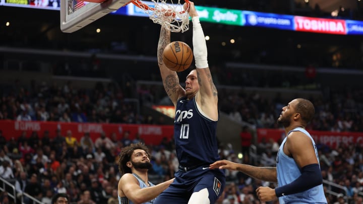 Dec 29, 2023; Los Angeles, California, USA;  Los Angeles Clippers center Daniel Theis (10) dunks the ball during the fourth quarter against the Memphis Grizzlies at Crypto.com Arena. Mandatory Credit: Kiyoshi Mio-USA TODAY Sports