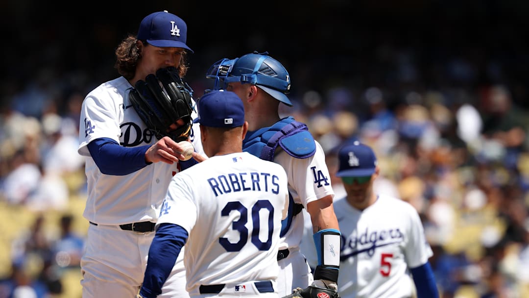 Apr 29, 2026; Los Angeles, California, USA;  Los Angeles Dodgers pitcher Tyler Glasnow (left) hands the ball to manager Dave Roberts (30) during the sixth inning against the Miami Marlins at Dodger Stadium. Mandatory Credit: Kiyoshi Mio-Imagn Images