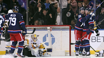 K'Andre Miller, Chris Kreider, and Reilly Smith celebrate a goal