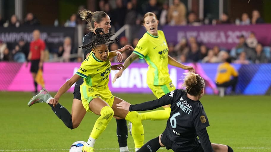 Washington Spirit midfielder Croix Bethune battles for the ball against Gotham FC defender Emily Sonnett.