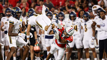 Sep 7, 2024; Tucson, Arizona, USA; Arizona Wildcats defensive back Treydan Stukes (2) tackles Northern Arizona Lumberjacks wide receiver Kolbe Katsis (11) during th second quarter at Arizona Stadium. Mandatory Credit: Aryanna Frank-Imagn Images