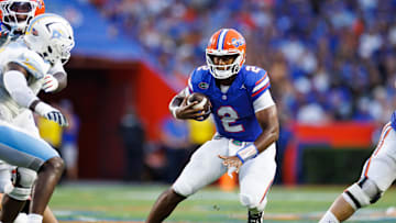 Aug 30, 2025; Gainesville, Florida, USA; Florida Gators quarterback DJ Lagway (2) scrambles with the ball against the Long Island Sharks during the first half at Ben Hill Griffin Stadium. Mandatory Credit: Matt Pendleton-Imagn Images