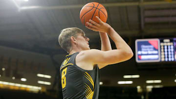 Iowa forward Cooper Koch (8) shoots against South Dakota Tuesday, Nov. 12, 2024 at Carver-Hawkeye Arena in Iowa City, Iowa.