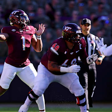 Sep 7, 2024; Blacksburg, Virginia, USA; Virginia Tech Hokies quarterback Kyron Drones (1) throws a pass during the first quarter against the Marshall Thundering Herd at Lane Stadium. Mandatory Credit: Peter Casey-Imagn Images