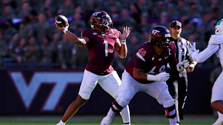 Sep 7, 2024; Blacksburg, Virginia, USA; Virginia Tech Hokies quarterback Kyron Drones (1) throws a pass during the first quarter against the Marshall Thundering Herd at Lane Stadium. Mandatory Credit: Peter Casey-Imagn Images