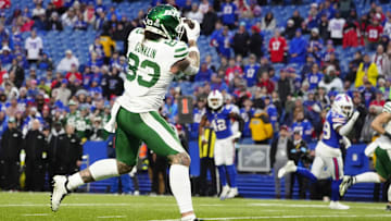 Dec 29, 2024; Orchard Park, New York, USA; New York Jets tight end Tyler Conklin (83) makes a catch and scores a touchdown against the Buffalo Bills during the second half at Highmark Stadium.
