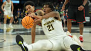 Nov 24, 2025; Las Vegas, Nevada, USA; Michigan Wolverines forward Morez Johnson Jr. (21) and San Diego State Aztecs guard Elzie Harrington (3) reach for a loose ball during the second half in a 2025 Players Era Festival group play game at Michelob Ultra Arena. Mandatory Credit: Kirby Lee-Imagn Images