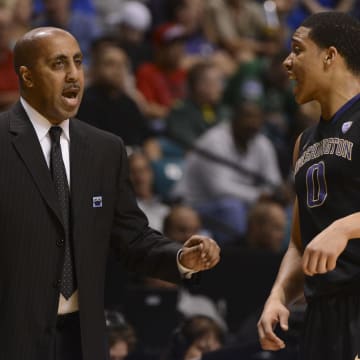Abdul Gaddy and UW coach Lorenzo Romar confer during the 2013 Pac-12 tournament. 