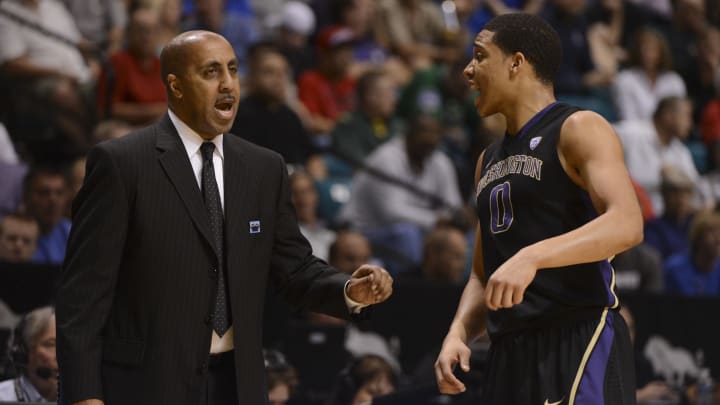 Abdul Gaddy and UW coach Lorenzo Romar confer during the 2013 Pac-12 tournament. 