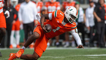 Nov 9, 2024; Atlanta, Georgia, USA; Miami Hurricanes quarterback Cam Ward (1) scrambles against the Georgia Tech Yellow Jackets in the second quarter at Bobby Dodd Stadium at Hyundai Field. Mandatory Credit: Brett Davis-Imagn Images
