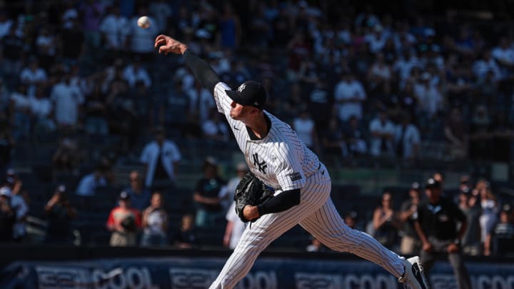 Aug 11, 2024; Bronx, New York, USA; New York Yankees relief pitcher Clay Holmes (35) delivers a pitch during the ninth inning against the Texas Rangers at Yankee Stadium. 