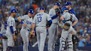 Oct 24, 2025; Toronto, Ontario, CAN; Los Angeles Dodgers pitcher Blake Snell (7) talks with catcher Will Smith (16) and third baseman Max Muncy (13) and second baseman Tommy Edman (25) and pitching coach Mark Prior (99) on the mound in the sixth inning during game one of the 2025 MLB World Series at Rogers Centre. Mandatory Credit: Nick Turchiaro-Imagn Images