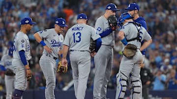 Oct 24, 2025; Toronto, Ontario, CAN; Los Angeles Dodgers pitcher Blake Snell (7) talks with catcher Will Smith (16) and third baseman Max Muncy (13) and second baseman Tommy Edman (25) and pitching coach Mark Prior (99) on the mound in the sixth inning during game one of the 2025 MLB World Series at Rogers Centre. Mandatory Credit: Nick Turchiaro-Imagn Images