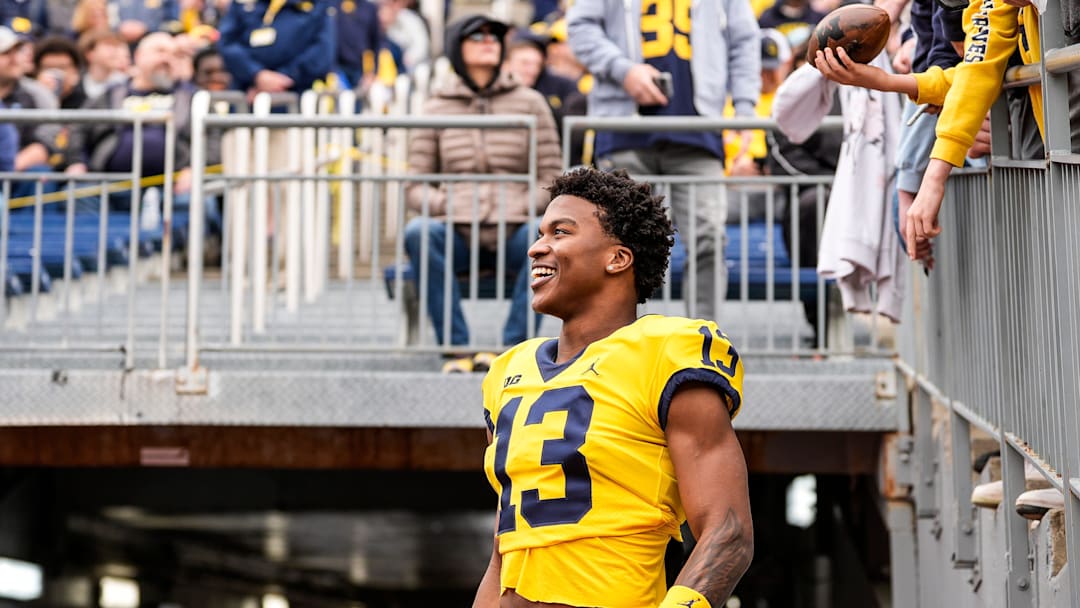 Michigan wide receiver Donaven McCulley (13) watches a play as he signs autographs for fans during the second half of the spring game at Michigan Stadium in Ann Arbor on Saturday, April 19, 2025.