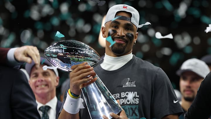 Feb 9, 2025; New Orleans, LA, USA; Philadelphia Eagles quarterback Jalen Hurts holds the Lombardi Trophy during the championship trophy presentation after the Eagles' game against the Kansas City Chiefs in Super Bowl LIX at Caesars Superdome. Mandatory Credit: Geoff Burke-Imagn Images Feb 9, 2025; New Orleans, LA, USA; Philadelphia Eagles quarterback Jalen Hurts holds the Lombardi Trophy during the championship trophy presentation after the Eagles' game against the Kansas City Chiefs in Super Bowl LIX at Caesars Superdome. Mandatory Credit: Geoff Burke-Imagn Images