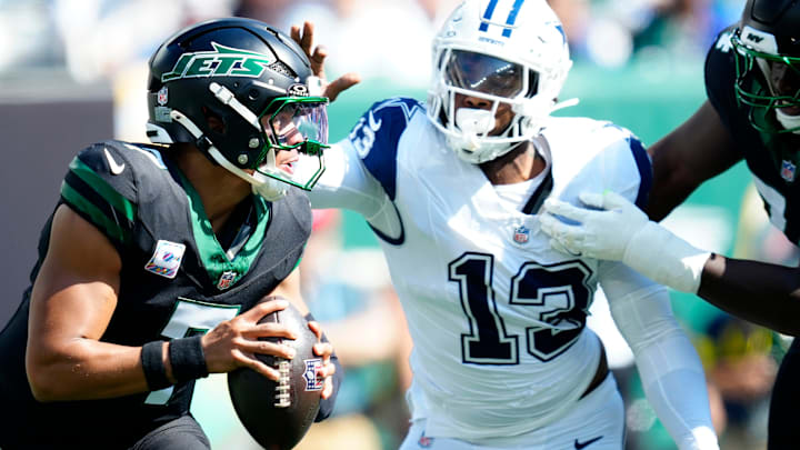 New York Jets quarterback Justin Fields (7) was able to throw the ball before Dallas Cowboys defensive end Dante Fowler Jr. (13) was able to get to him, Sunday, October 5, 2025. New York Jets quarterback Justin Fields (7) was able to throw the ball before Dallas Cowboys defensive end Dante Fowler Jr. (13) was able to get to him, Sunday, October 5, 2025.