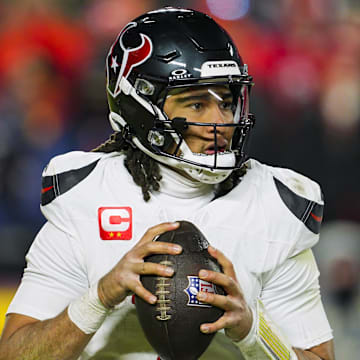 Jan 18, 2025; Kansas City, Missouri, USA; Houston Texans quarterback C.J. Stroud (7) drops back to pass during the second half against the Kansas City Chiefs in a 2025 AFC divisional round game at GEHA Field at Arrowhead Stadium. Mandatory Credit: Jay Biggerstaff-Imagn Images