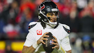 Jan 18, 2025; Kansas City, Missouri, USA; Houston Texans quarterback C.J. Stroud (7) drops back to pass during the second half against the Kansas City Chiefs in a 2025 AFC divisional round game at GEHA Field at Arrowhead Stadium. Mandatory Credit: Jay Biggerstaff-Imagn Images