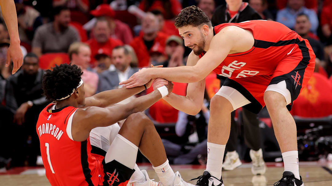 May 1, 2026; Houston, Texas, USA; Houston Rockets center Alperen Sengun (28) helps up Houston Rockets guard Amen Thompson (1) against the Los Angeles Lakers during the second quarter of game six of the first round of the 2026 NBA Playoffs at Toyota Center. Mandatory Credit: Erik Williams-Imagn Images