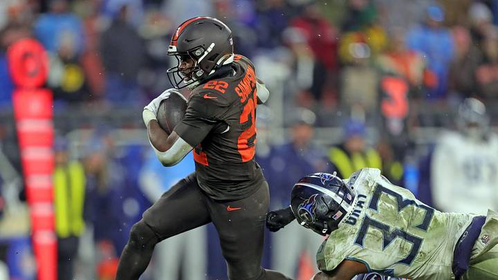 Cleveland Browns running back Dylan Sampson (22) breaks away from Tennessee Titans linebacker Cedric Gray (33) for a first down during the second half of an NFL football game at Huntington Bank Field, Dec. 7, 2025, in Cleveland, Ohio.