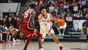 Jan 4, 2025; Tuscaloosa, Alabama, USA; Alabama Crimson Tide guard Mark Sears (1) drives against Oklahoma Sooners guard Duke Miles (15) during the first half at Coleman Coliseum. Mandatory Credit: Will McLelland-Imagn Images