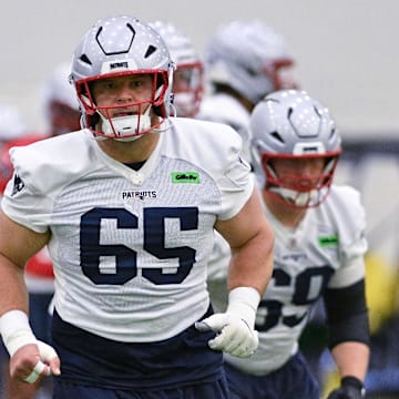 Jun 10, 2025; Foxborough, MA, USA; New England Patriots center Garrett Bradbury (65) does a drill during minicamp held in the WIN Field House at Gillette Stadium. Mandatory Credit: Eric Canha-Imagn Images