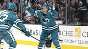 Oct 10, 2024; San Jose, California, USA; San Jose Sharks center Macklin Celebrini (71) reacts after center Tyler Toffoli (73) scores a goal during the first period against the St. Louis Blues at SAP Center at San Jose. Mandatory Credit: Stan Szeto-Imagn Images