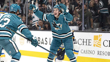 Oct 10, 2024; San Jose, California, USA; San Jose Sharks center Macklin Celebrini (71) reacts after center Tyler Toffoli (73) scores a goal during the first period against the St. Louis Blues at SAP Center at San Jose. Mandatory Credit: Stan Szeto-Imagn Images