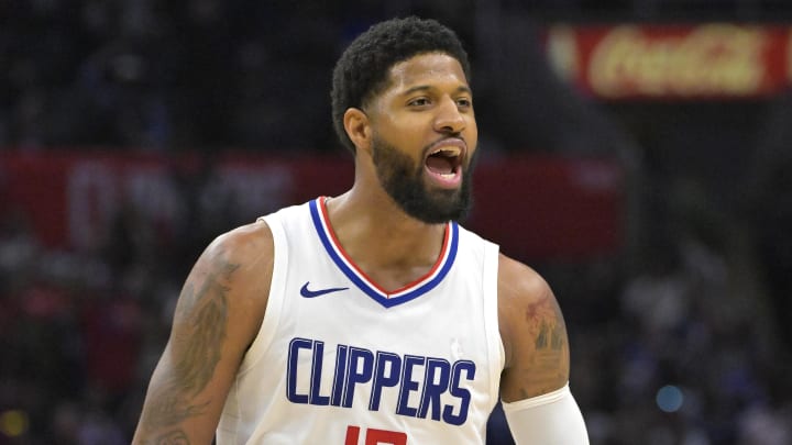 Apr 7, 2024; Los Angeles, California, USA; Los Angeles Clippers forward Paul George (13) celebrates after a three point basket in the fourth quarter against the Cleveland Cavaliers at Crypto.com Arena.