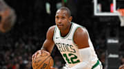 Nov 24, 2024; Boston, Massachusetts, USA; Boston Celtics center Al Horford (42) controls the ball against the Minnesota Timberwolves during the first half at TD Garden. Mandatory Credit: Eric Canha-Imagn Images