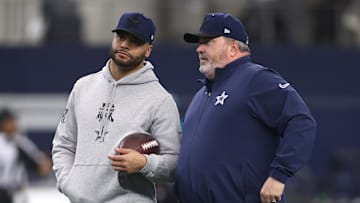 Jan 5, 2025; Arlington, Texas, USA; Dallas Cowboys quarterback Dak Prescott (4) talks to head coach Mike McCarthy before the game against the Washington Commanders at AT&T Stadium. Mandatory Credit: Tim Heitman-Imagn Images