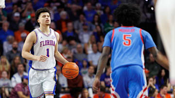 Mar 8, 2025; Gainesville, Florida, USA; Florida Gators guard Walter Clayton Jr. (1) dribbles the ball while Mississippi Rebels guard Jaylen Murray (5) defends during the second half at Exactech Arena at the Stephen C. O'Connell Center. Mandatory Credit: Matt Pendleton-Imagn Images